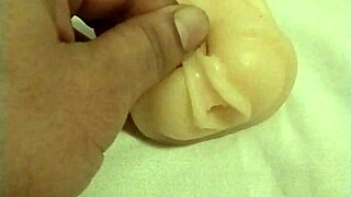 i'm playin with this artificial pussy, fingerin my ass and tits, oh god.