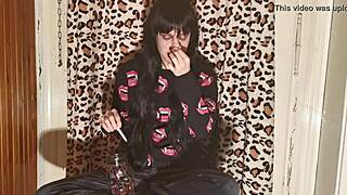 smoking goth girl relaxes behind the scenes after a long day