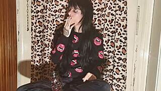 smoking goth girl relaxes behind the scenes after a long day