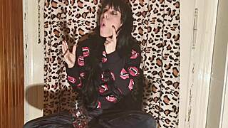 smoking goth girl relaxes behind the scenes after a long day