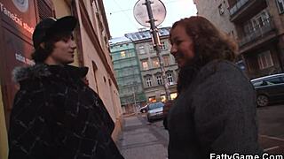 A curvy woman meets a man she met on the street.