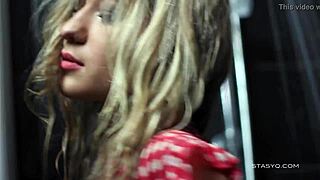 Darina, this cute Russian amateur, dances erotically in the shower, flaunting her big tits in a solo softcore moment.