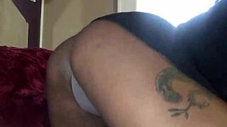 Having some bed fun with black thong panties on ebony ass