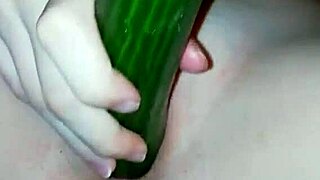 girl uses cucumber for homemade fun
