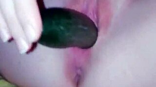 girl uses cucumber for homemade fun