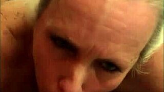 check out this mature milf with huge tits and ass sucking big black cocks and getting facials