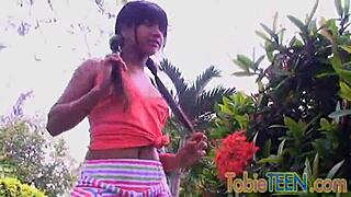 tobie teen teases and fingers her tight pussy outdoors
