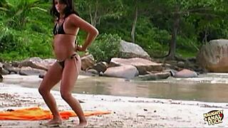 Pretty brunette has hot anal sex on the beach