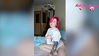 redhead bitch slips a butt plug in and teases her tight pussy