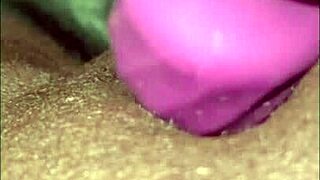 milaj, a chubby black bbw with big tits, tests a new wand vibrator on her pussy and clit in close-up