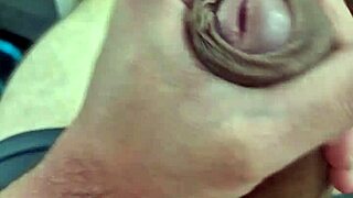 A sexy amateur twink shows off his big dick in a solo scene
