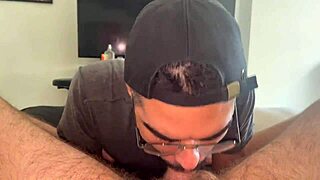 He watches the big white cock EXPLODE in his mouth, filling it with cum.
