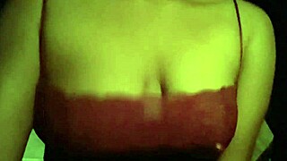 yo, check this black babe sucking nipples in red tank top