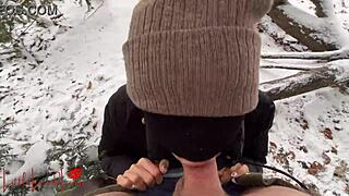 Asian girl gives a blowjob in the snow, almost getting caught in the public park.