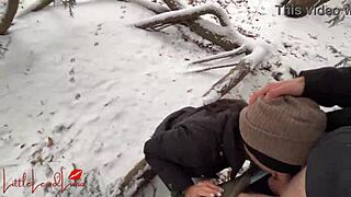 Asian girl gives a blowjob in the snow, almost getting caught in the public park.