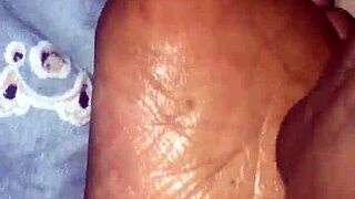 Girlfriend gives footjob in detailed scene.