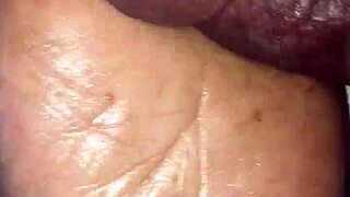 Girlfriend gives footjob in detailed scene.