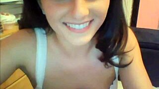 Sexy college girl teases with a hot strip on cam