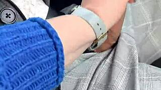 Amateur blowjob in moving car, risky public act.