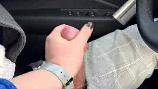 Amateur blowjob in moving car, risky public act.