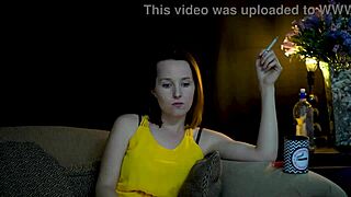 Brunette woman sucks on cigarette while gazing voyeuristically