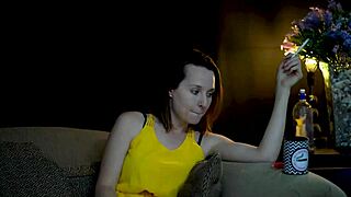 Brunette woman sucks on cigarette while gazing voyeuristically