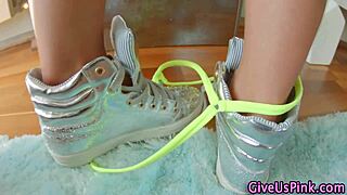 A classy woman engages in solo play with toys.