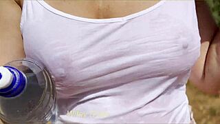 Sexy milf public exhibitionist dare - wet shirt in public and lets stranger pour water on her braless boobs