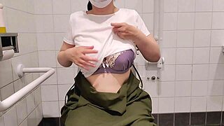 Japanese milf indulges in private bathroom self-pleasure. Her intimate solo moment unfolds in a quiet store setting.