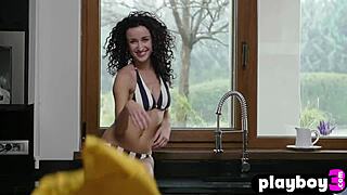 Hey, wanna see petite curly Lucy M pose naked in the kitchen with small tits?