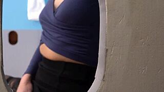 Charlotte Sins kneels to suck a massive black gloryhole cock in stockings and heels.