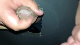 guy visits swing house to jerk off through glory hole, surprising his wife