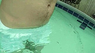Pool boy in see-through outfit underwater