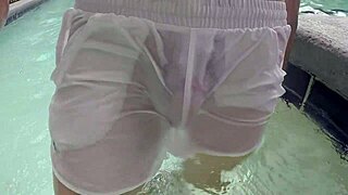 Pool boy in see-through outfit underwater