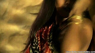 The eastern indian dancer, a brunette milf, performs a solo dance and gets exposed