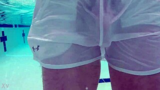 Pool boy in see-through outfit underwater