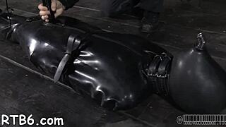 Femdom BDSM with a leather-clad mistress and a willing sub