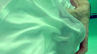 Pool boy in see-through outfit underwater