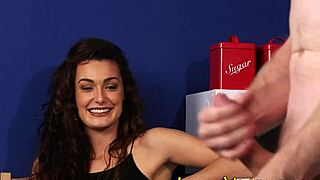 clothed brunette keeps an eye on the action in high-def fetish scene