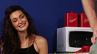 clothed brunette keeps an eye on the action in high-def fetish scene