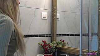 Beautiful blonde in sexy panties in the bathroom