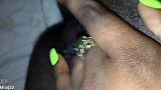 an old ebony woman fingers her tight wet pussy