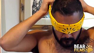 Bearfilms features blindfolded gay bear Avi Strider in solo jerk session