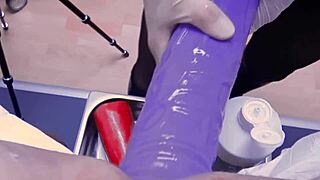 Femdom BDSM scene with a huge toy and an anal examination