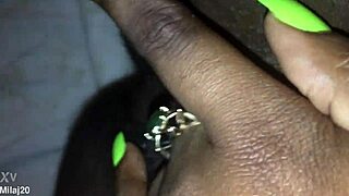 an old ebony woman fingers her tight wet pussy