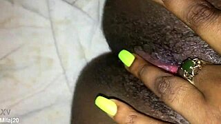 an old ebony woman fingers her tight wet pussy