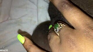 an old ebony woman fingers her tight wet pussy