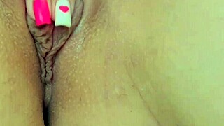 Young horny cutie orgasms from fingering her shaved pussy in homemade video!