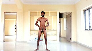 Rajesh Playboy 993 strips, spanks dick, moans, and cums in a cup