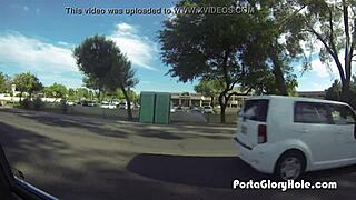 in the porta gloryhole, a redhead's mouth gets pumped full of cum